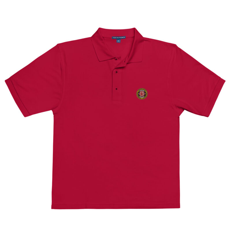 polo shirt featuring the Lions Den logo and ServPro sponsorship badge on the chest, representing the elite status in the firefighter challenge.