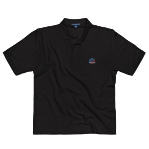 A black polo shirt featuring the Firefighter Challenge Championship Series logo on the chest, representing the firefighting community's premier event, sponsored by ServPro.