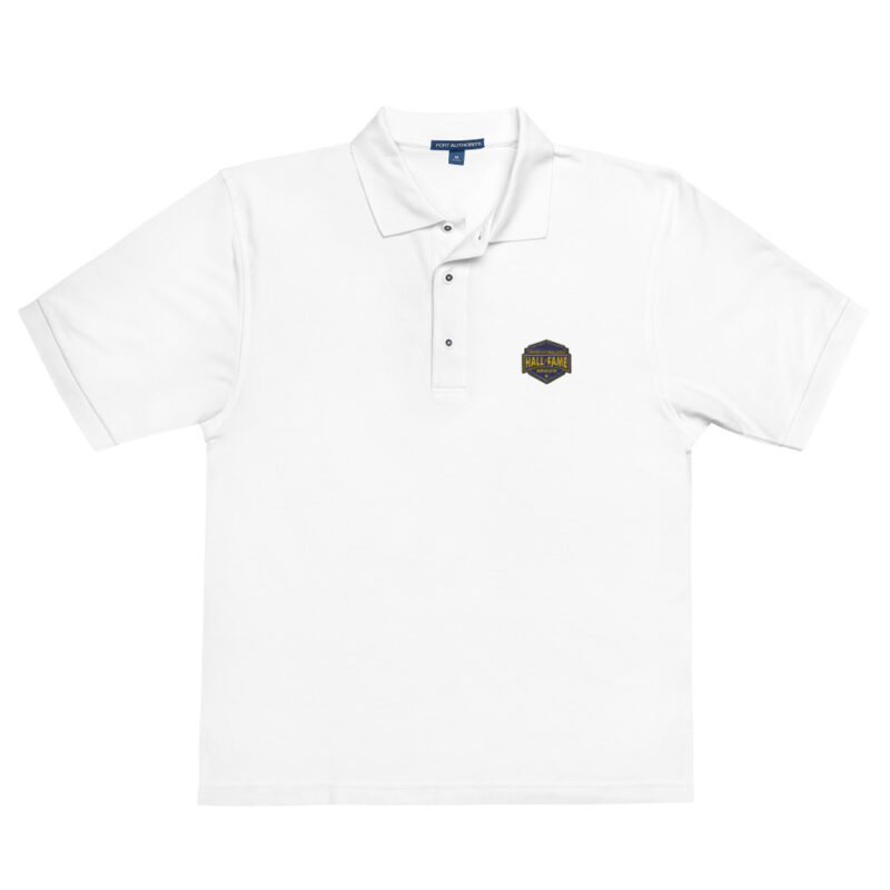 polo shirt featuring the Firefighter Challenge Hall of Fame logo and ServPro sponsorship badge on the chest, representing the honor and legacy of the championship.