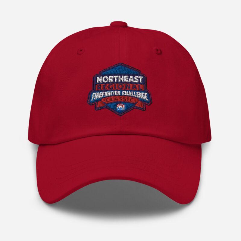 A red cap featuring the Northeast Regional Firefighter Challenge Classic logo embroidered on the front, representing the Northeast region's participation in the Firefighter Challenge Championship.