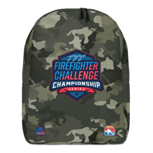 A camouflage-patterned backpack with the Firefighter Challenge Championship logo in the center. Additional small FCCS and SERVPRO logos are positioned at the bottom.