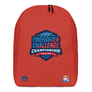 A bright red backpack featuring the Firefighter Challenge Championship logo in the center, with smaller SERVPRO and Championship logos near the bottom.