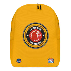 A yellow backpack featuring the Lion's Den Member emblem in the center, displaying a red lion's head and Firefighter Challenge logos near the bottom.