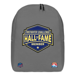 A gray backpack displaying the Firefighter Challenge Hall of Fame Member emblem, celebrating the achievements of firefighting champions.