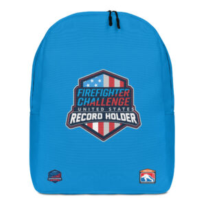 A blue backpack featuring the Firefighter Challenge United States Record Holder logo with a red, white, and blue shield design. Two additional small logos are positioned in the bottom corners.