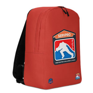 A red backpack displaying the Firefighter Challenge League (FCL) logo prominently in the center with two smaller badges at the bottom corners.