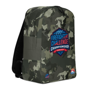 A camouflage-patterned backpack with the Firefighter Challenge Championship logo in the center. Additional small FCCS and SERVPRO logos are positioned at the bottom.