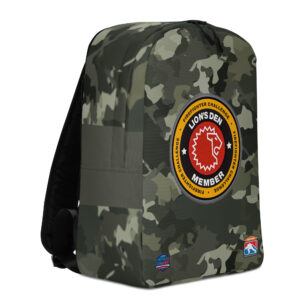 A camo-patterned backpack featuring the Lion’s Den Member emblem prominently in the center, with the Firefighter Challenge logos at the bottom.