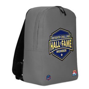 A gray backpack displaying the Firefighter Challenge Hall of Fame Member emblem, celebrating the achievements of firefighting champions.