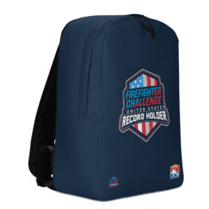 A navy blue backpack featuring the Firefighter Challenge United States Record Holder logo in the center with a red, white, and blue shield design. Two smaller logos are present at the bottom.