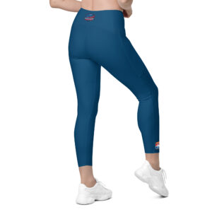 Woman wearing blue SERVPRO® Firefighter Challenge League leggings with the FCL logo on the ankle.