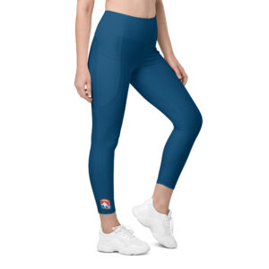 Woman wearing blue SERVPRO® Firefighter Challenge League leggings with the FCL logo on the ankle.