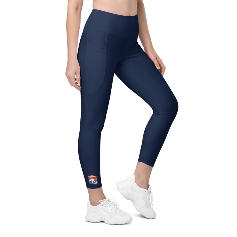 Woman wearing navy SERVPRO® Firefighter Challenge League leggings with the FCL logo on the ankle.