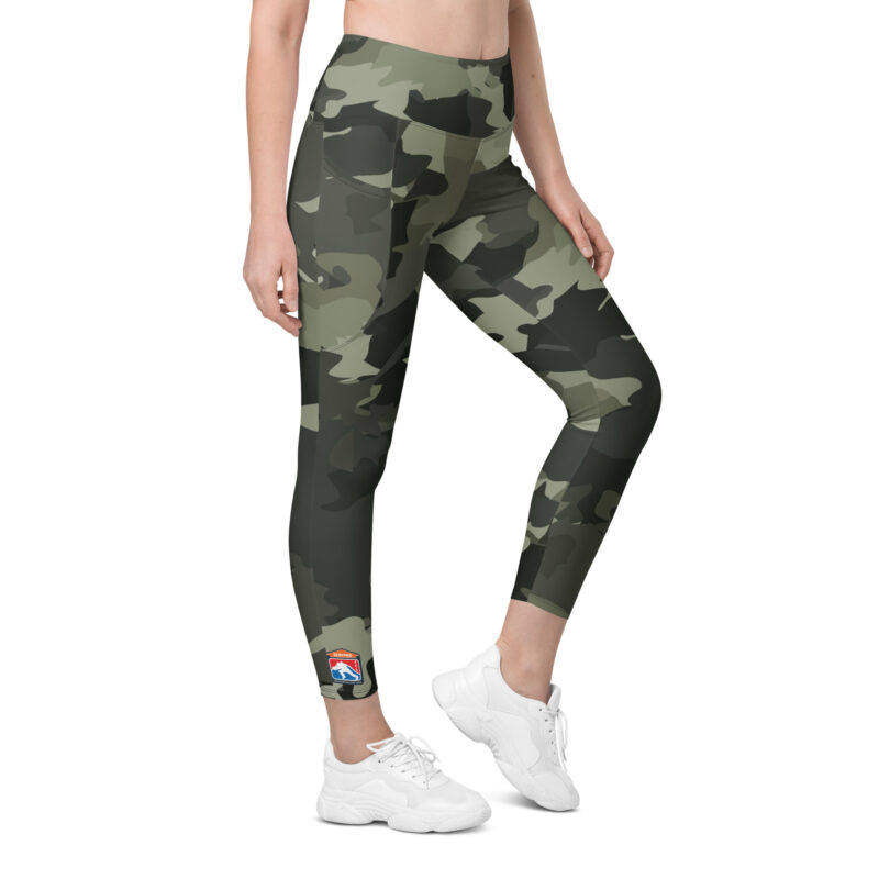 Woman wearing SERVPRO® Firefighter Challenge League camouflage leggings with official FCL logo on the ankle.