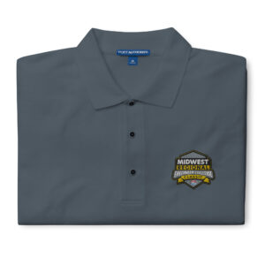 A Midwest Regional Firefighter Challenge polo with an embroidered regional logo on the chest, available in colors such as Cool Grey, Black, Red, Steel Grey, Stone, and White. Designed with a relaxed fit and soft cotton-poly blend.