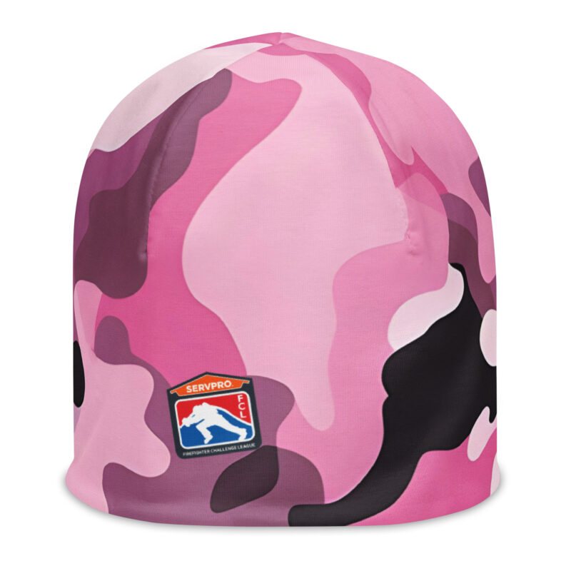 A pink camouflage beanie featuring the SERVPRO® Firefighter Challenge League logo on the front. The beanie has a vibrant mix of pink, purple, black, and white camo patterns, offering a bold and stylish look.